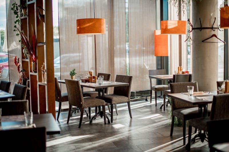 Interior of Cafe Rio restaurant with warm lighting and wood accents